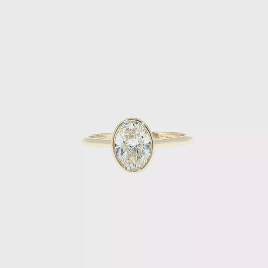1.05ctw F/VS1 Oval Cut(certified) Lab-Grown Diamond Bezel set Solitaire Ring in 14kt Yellow Gold